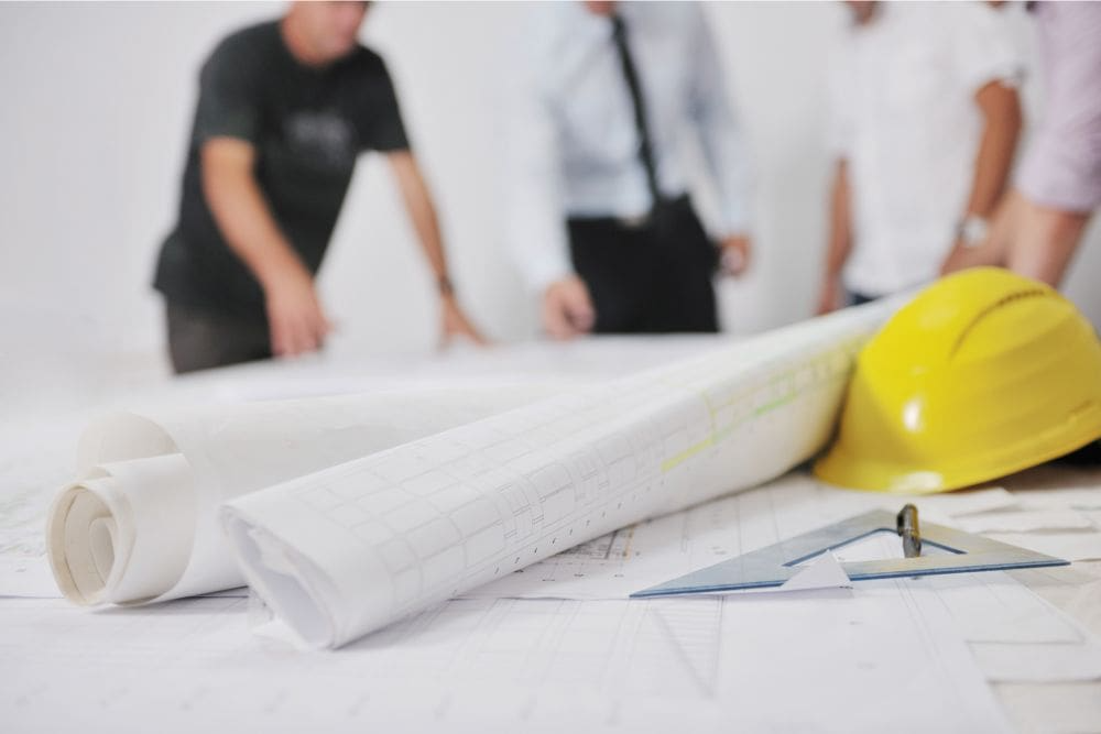 Homeowners Go Over the Kitchen Remodeling Details with a Contractor Homeowners Go Over the Kitchen Remodeling Details with a Contractor